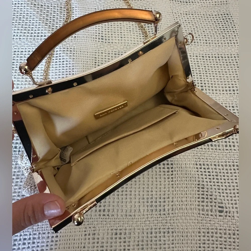 Elegant Casual couture Cream Woven Handbag with Gold Accents